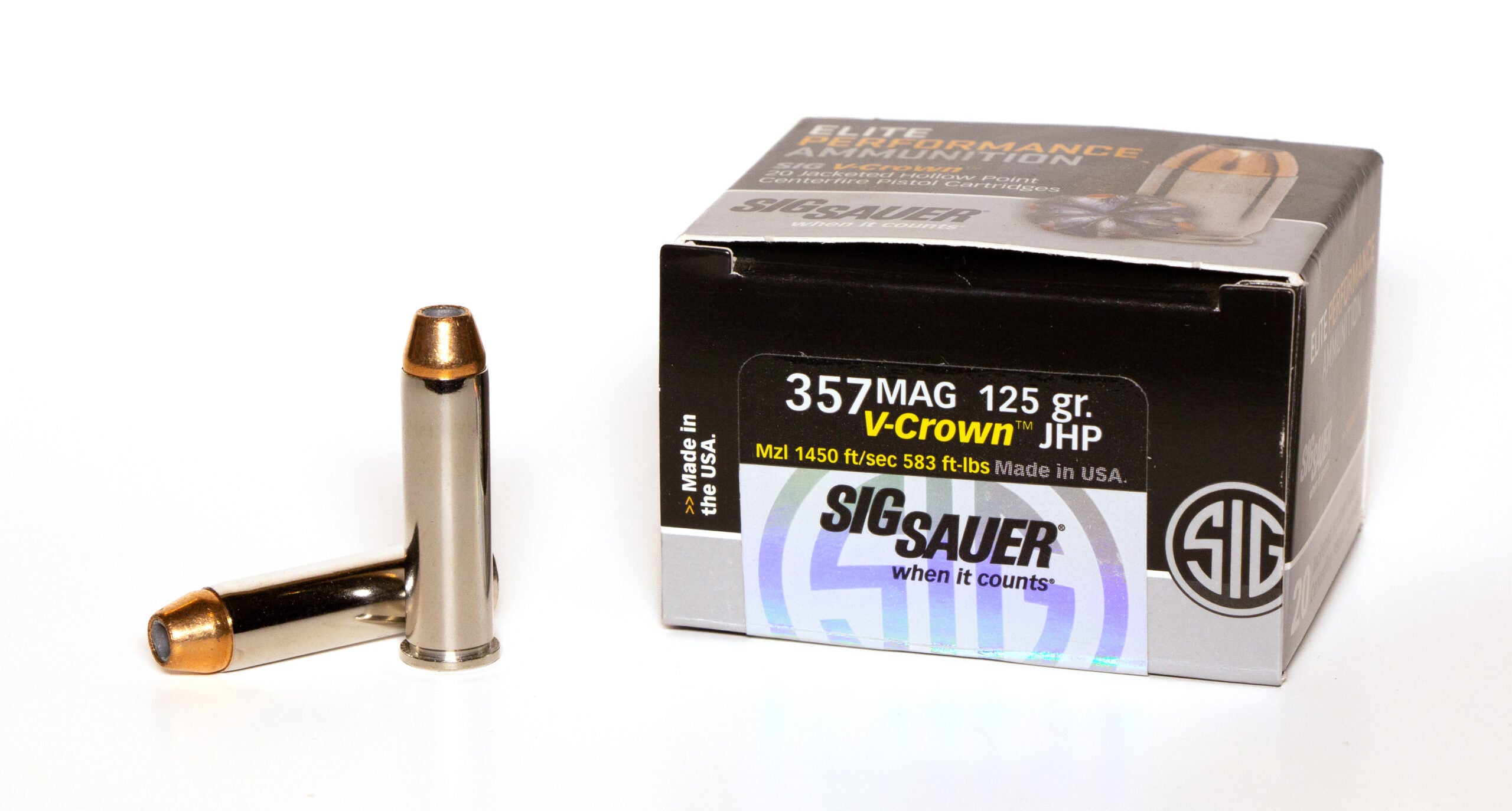 Box of 357 Magnum ammo with loose cartridges on white background