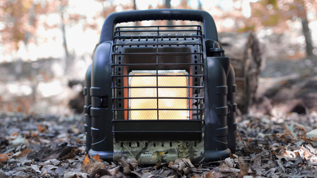 Mr. Heater Buddy hunting portable propane heater sitting in the woods