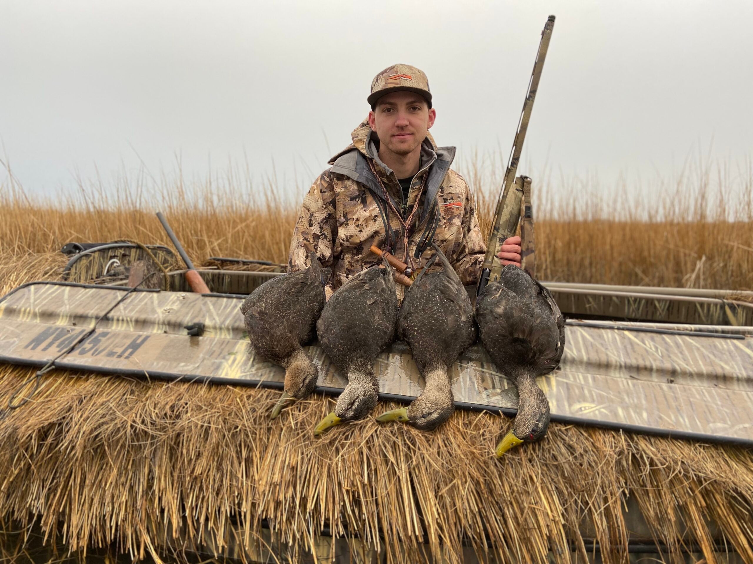 hunter with a two-man limit of black ducks