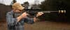 Shooter fires the Colt CBX TAC Hunter rifle with silencer, from the off-hand position
