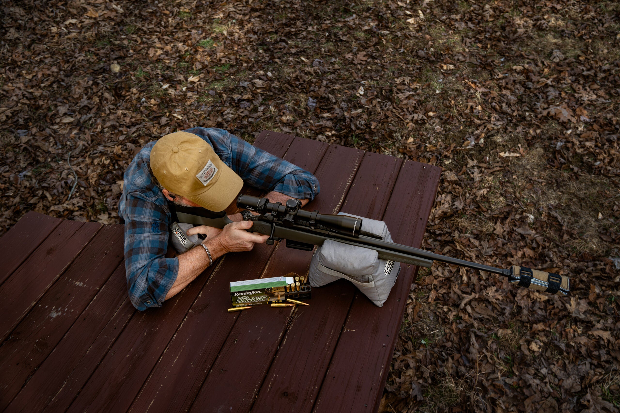 A shooter fires the new Colt CBX TAC Hunter bolt-action rifle from a benchrest.