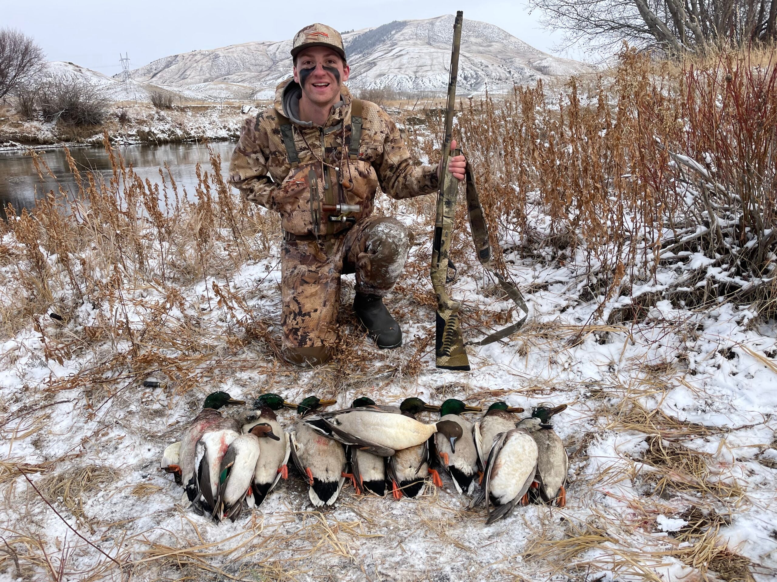 The author with a two-man limit shot over Final Approach live floating mallards in western Colorado.