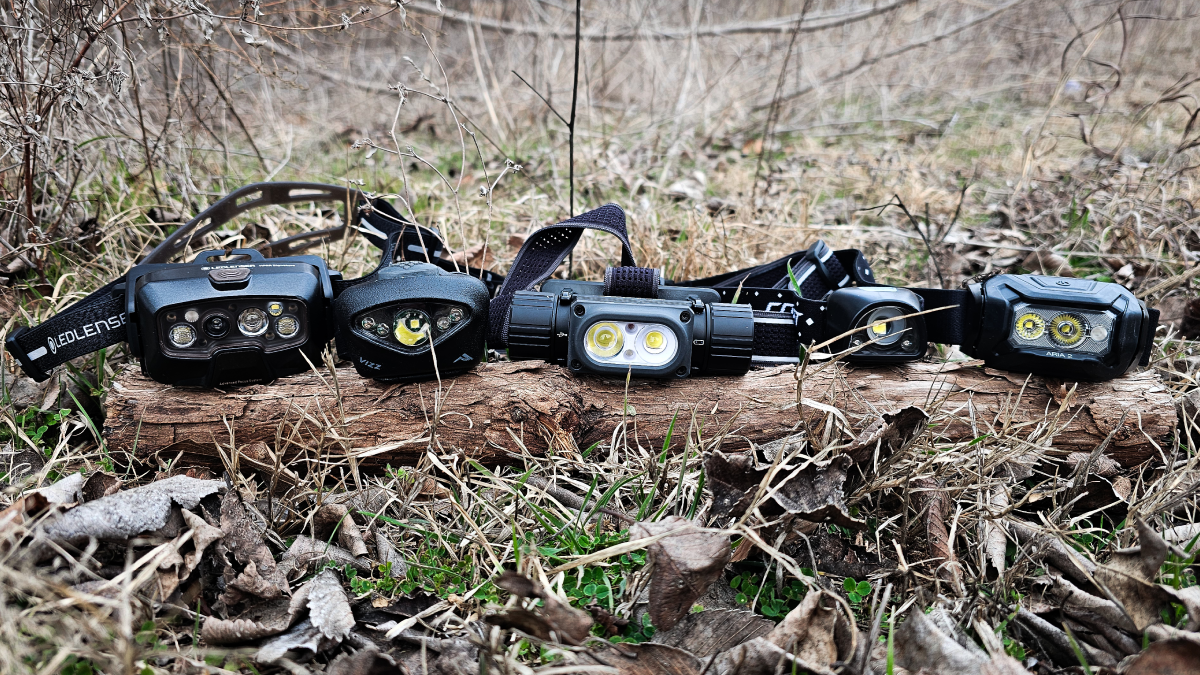 Best headlamps we tested lined up on log in forest