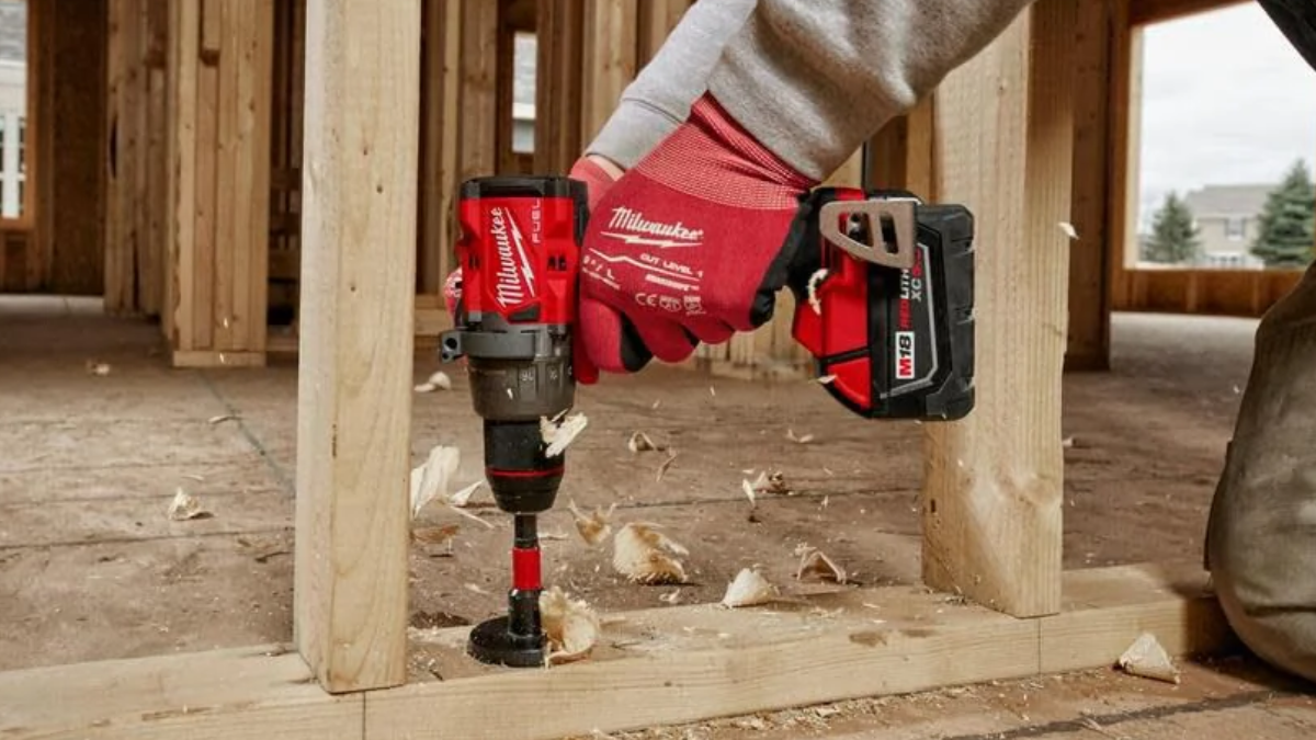 Man using Milwaukee M18 Cordless 1/2" drill driver on renovation project