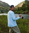 Tanner Sutton, Free Fly founder, holding fishing rod
