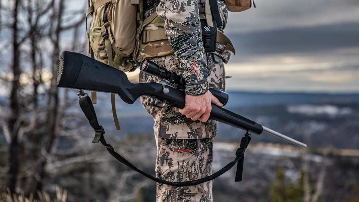 Hunter holding Savage 110 Lightweight Storm Rifle