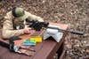 Shooter tests the Stag Arms Pursuit Bolt Action Rifle from a benchrest