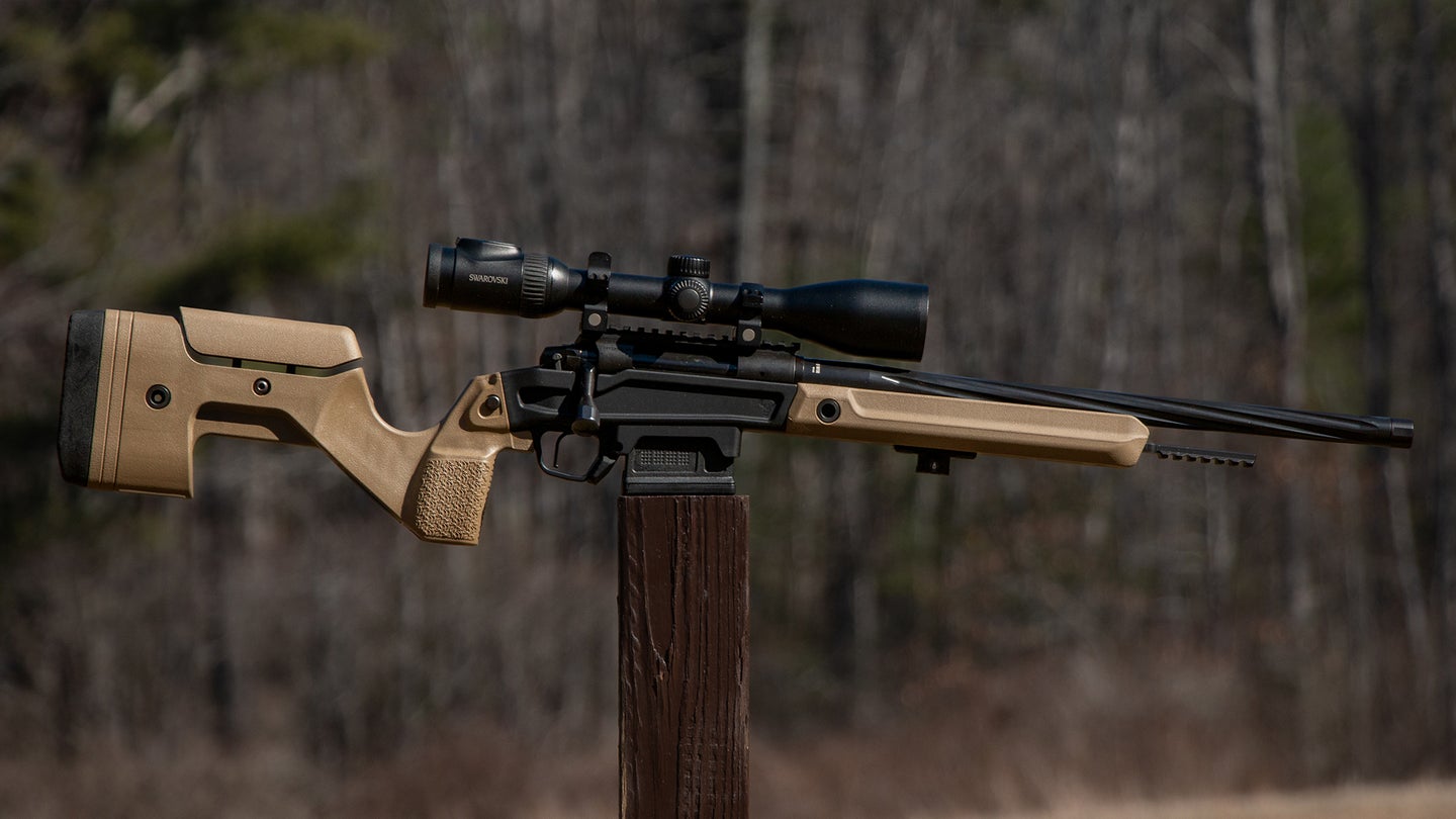 The new Stag Arms Pursuit Bolt Action Rifle resting on a post with woods in background
