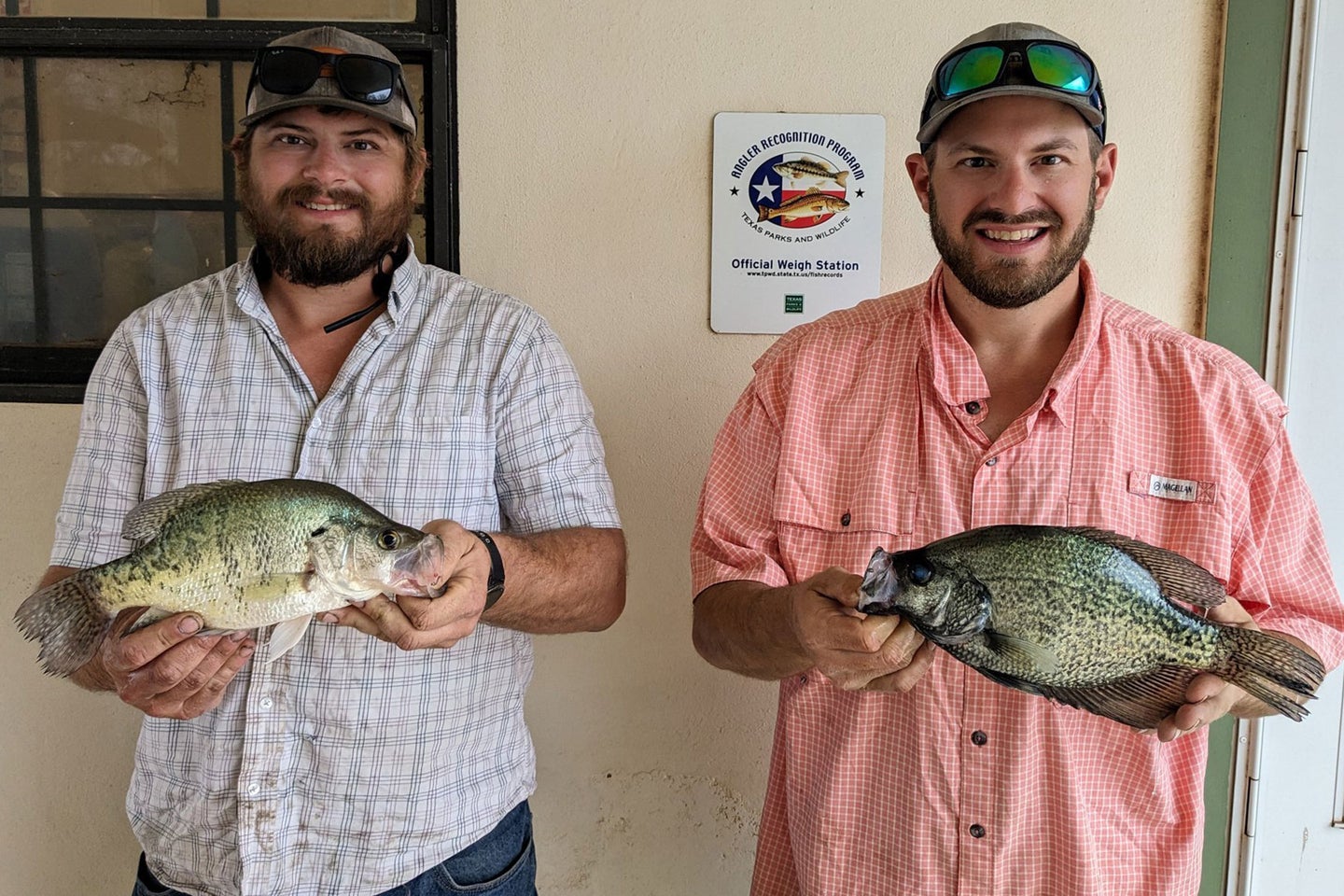 Brothers pose with record-breaking crappie in Texas.