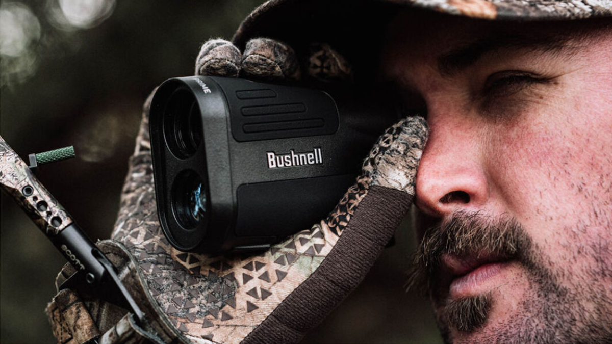 Hunter looking through Bushnell Prime 1500 Laser Rangefinder