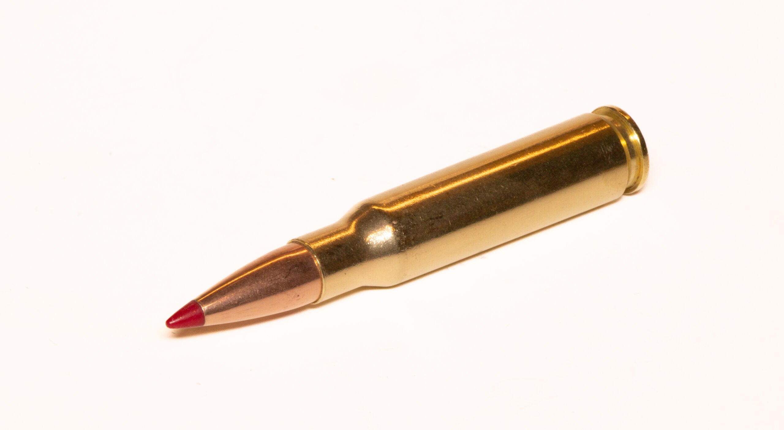 A 308 Winchester cartridge on a white background