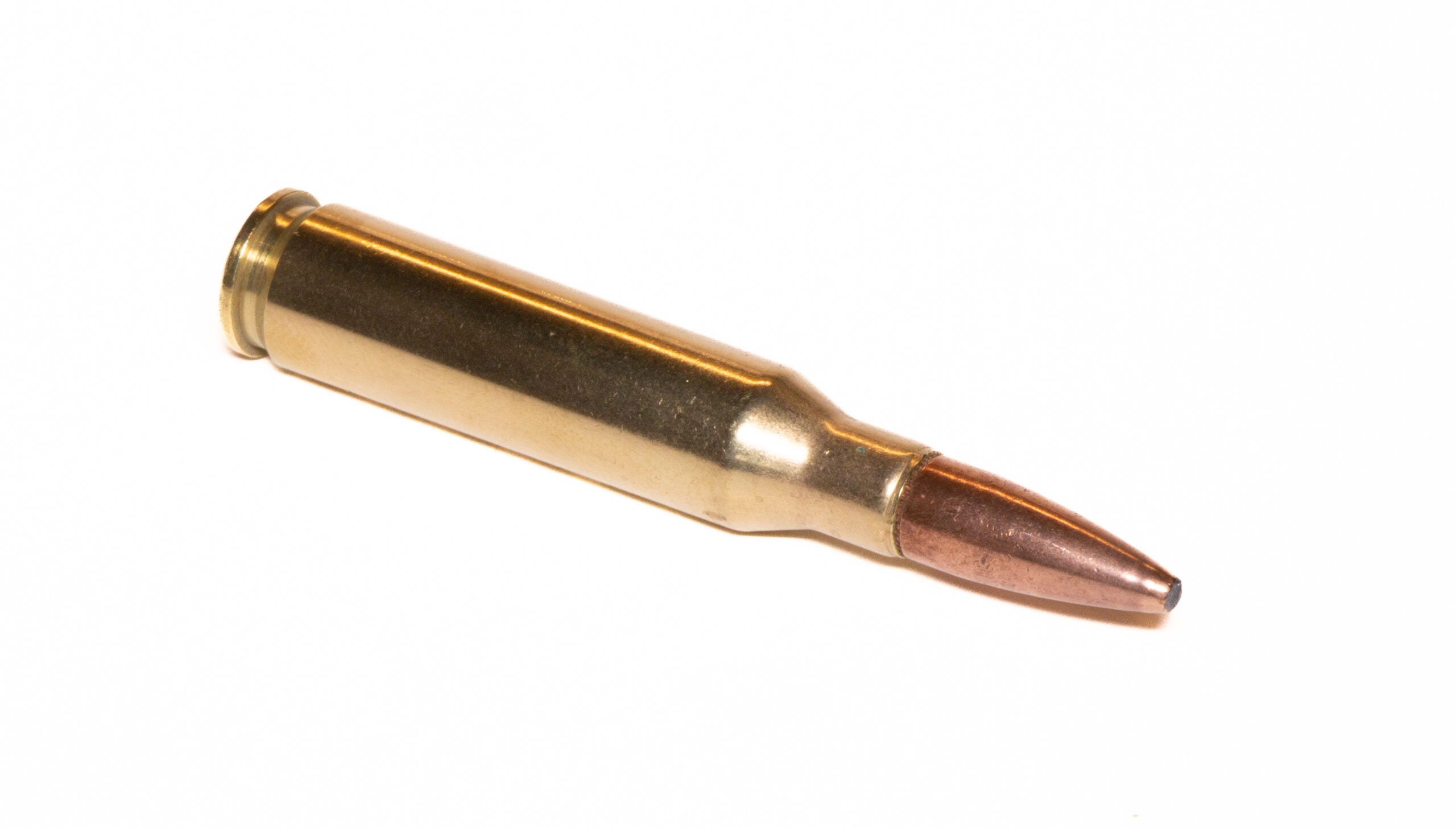 Photo of a 7mm 08 Remington cartridge on white background