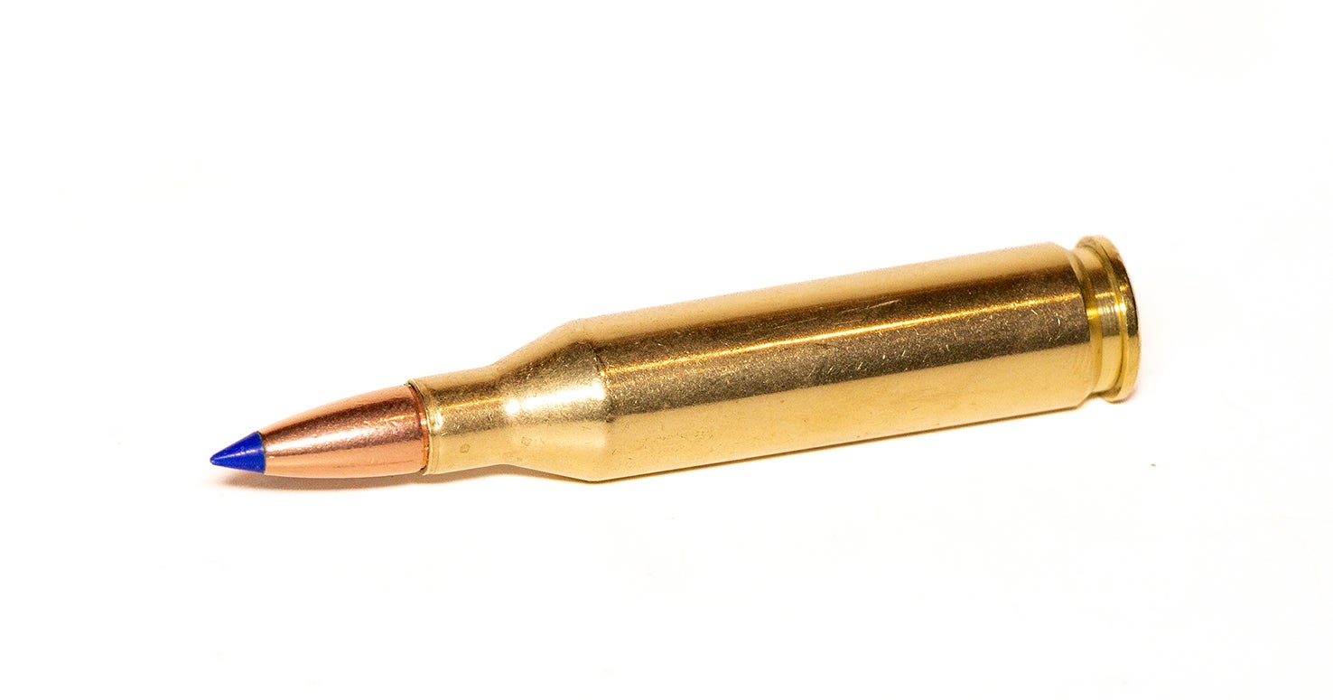 A 243 Remington cartridge on a white background