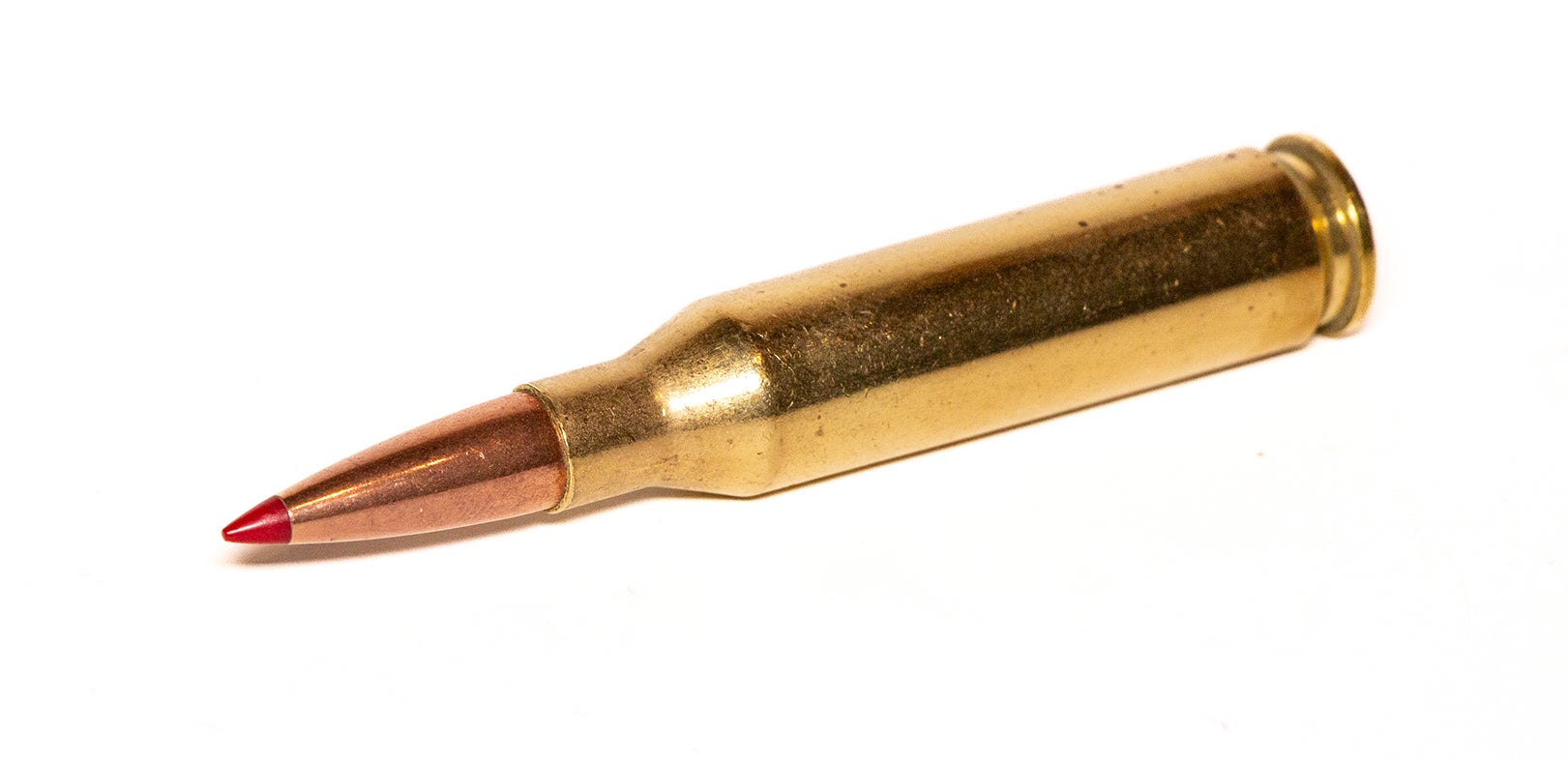 A 260 Remington cartridge on a white backgound