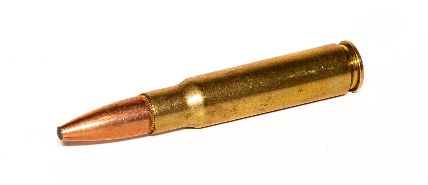 A 338 Federal cartridge on a white background