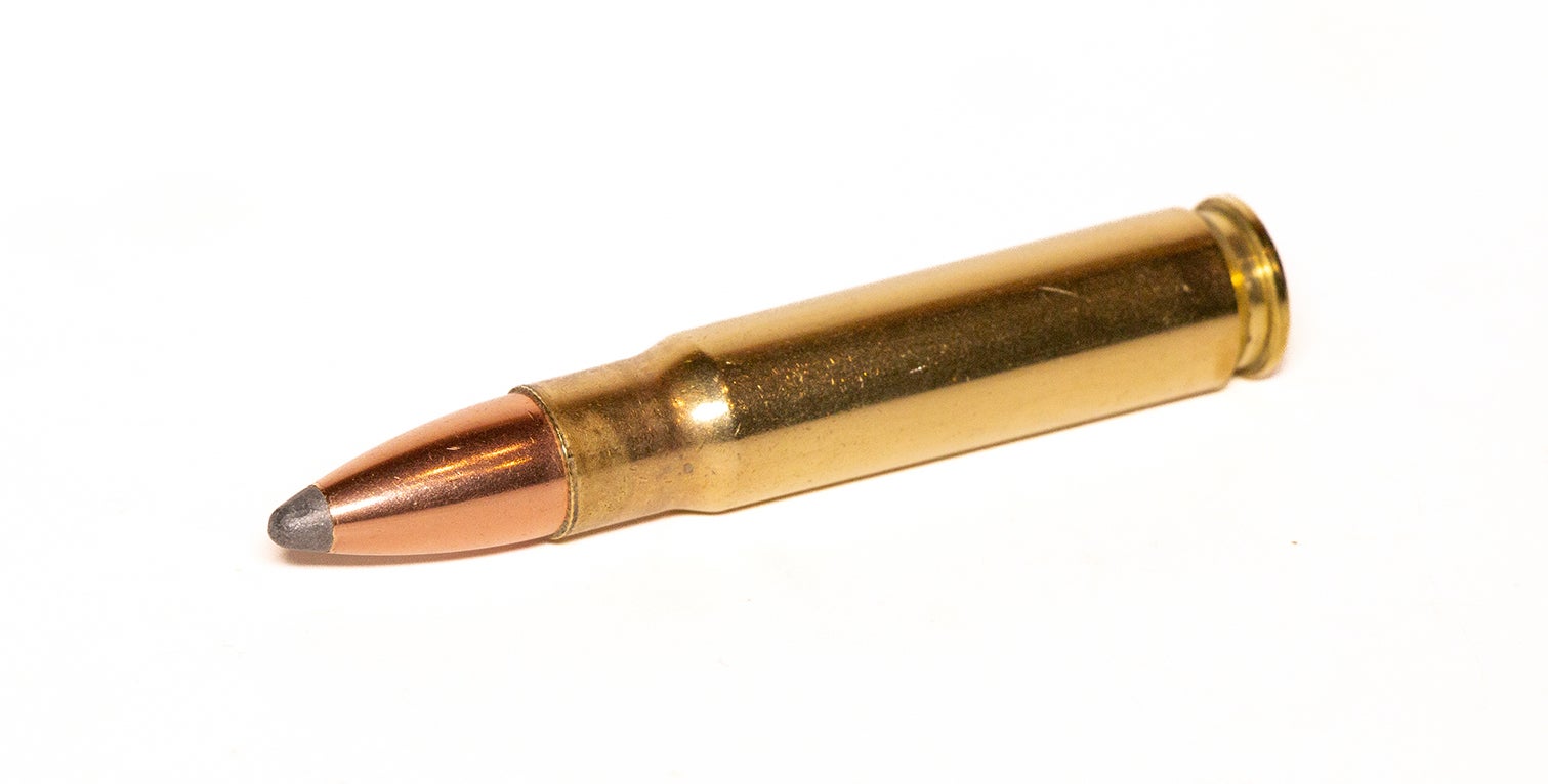 A 358 Winchester cartridge on a white background