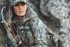 Female bowhunter wearing DSG Outerwear in the field