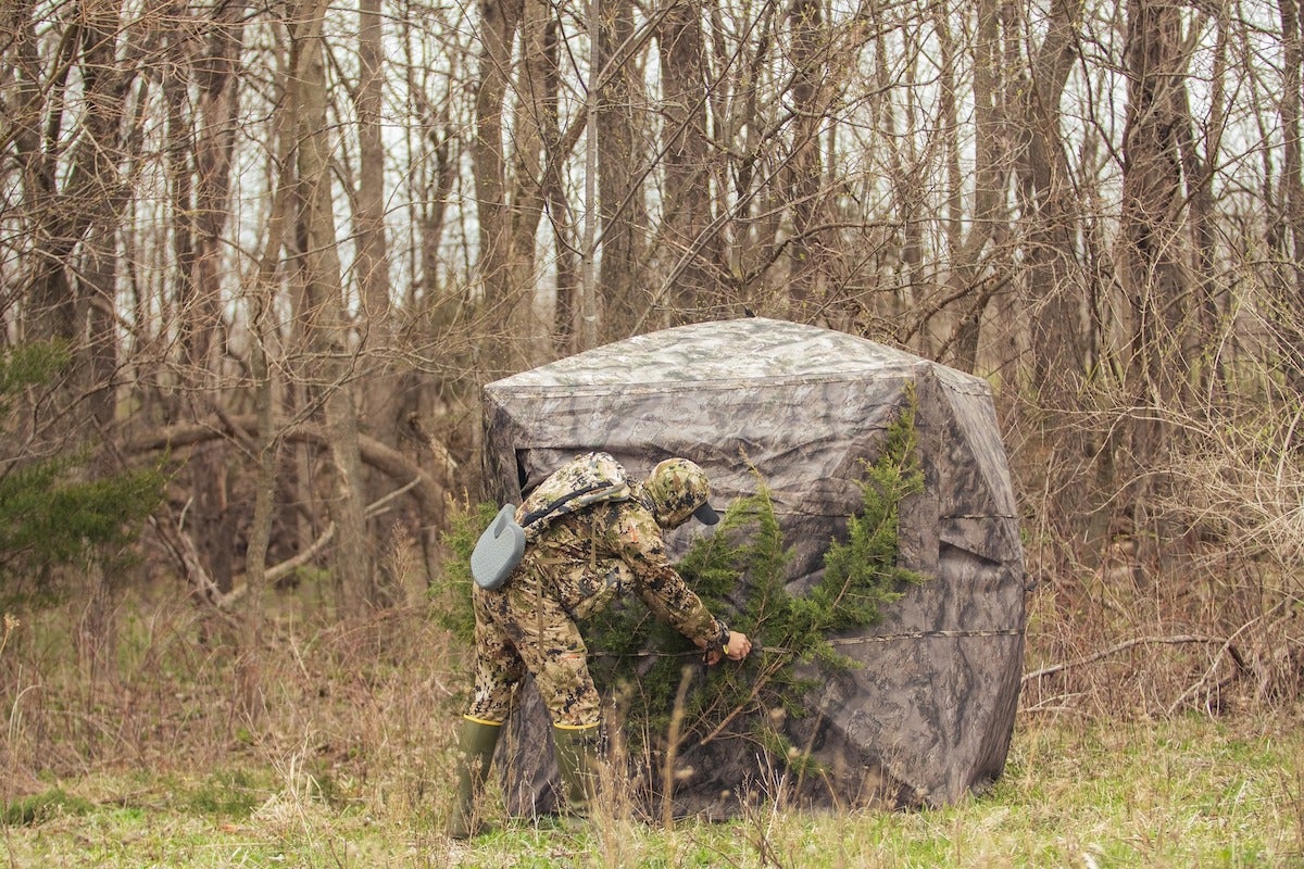 Bowhunter stepping into Muddy Prevue Ground Blind