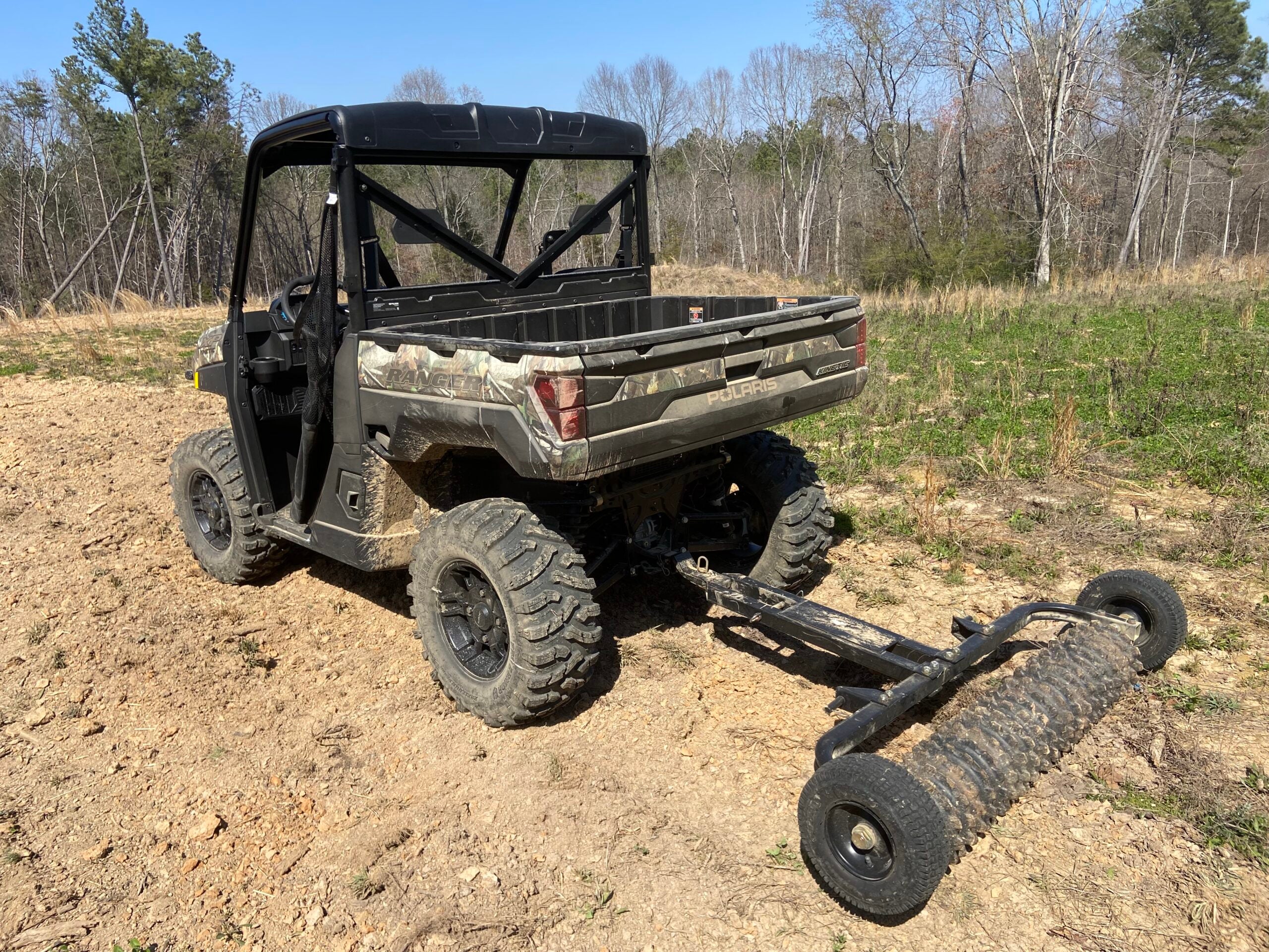Polaris's new electric Ranger UTV being used to cultipack a food plot.