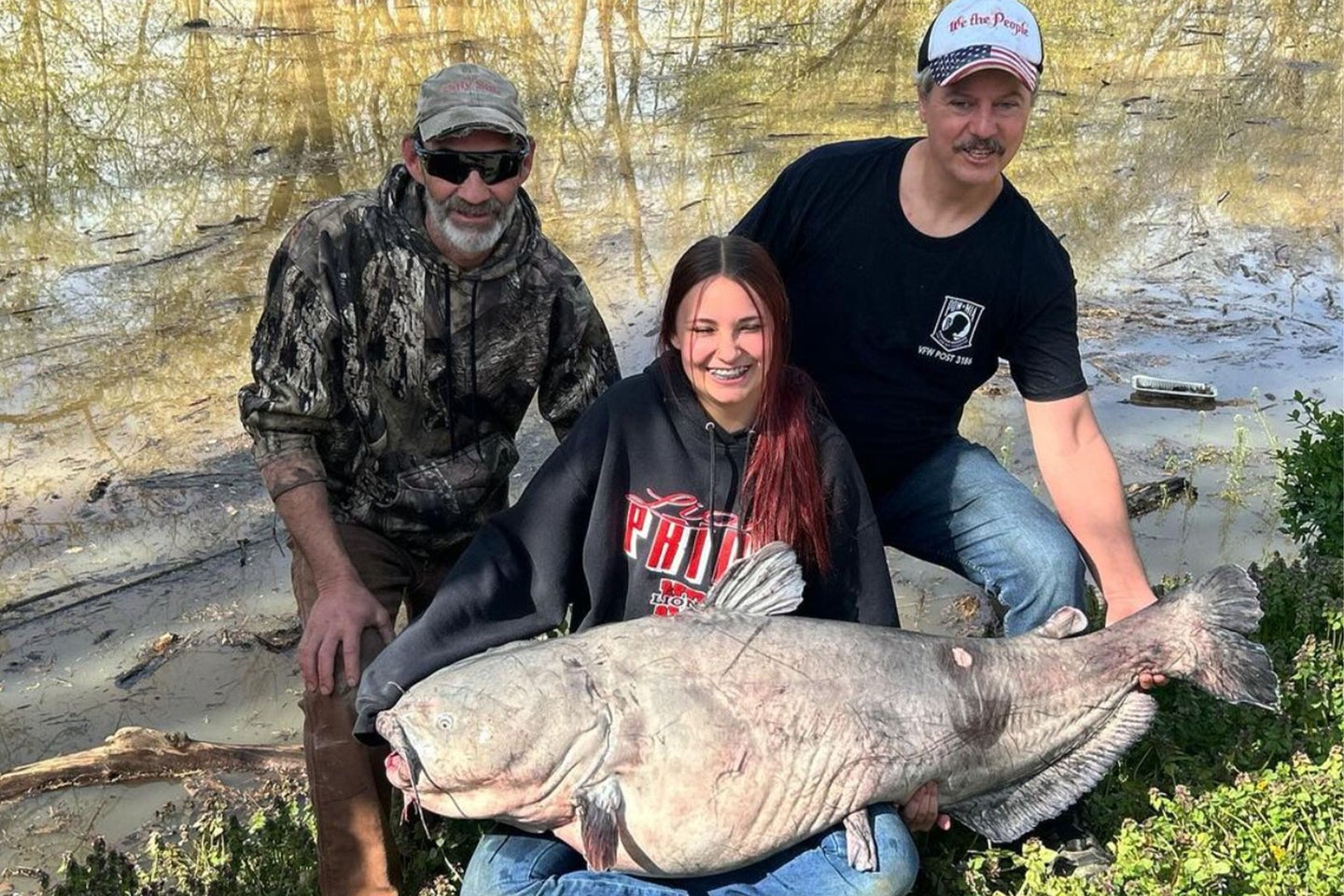 Ohio teen poses with record-sized catfish.