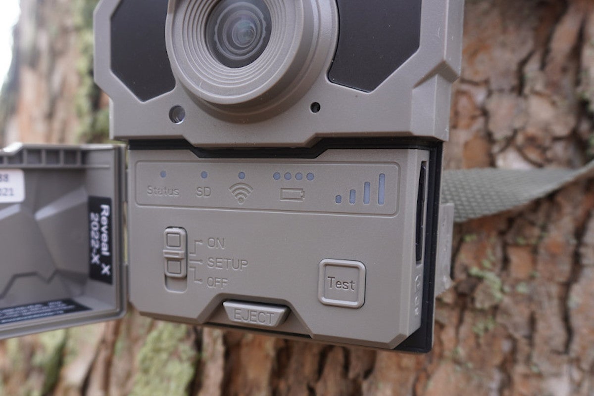 Close-up of Tactacam Reveal X 2.0 Trail Camera mounted on tree