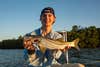angler holding up snook
