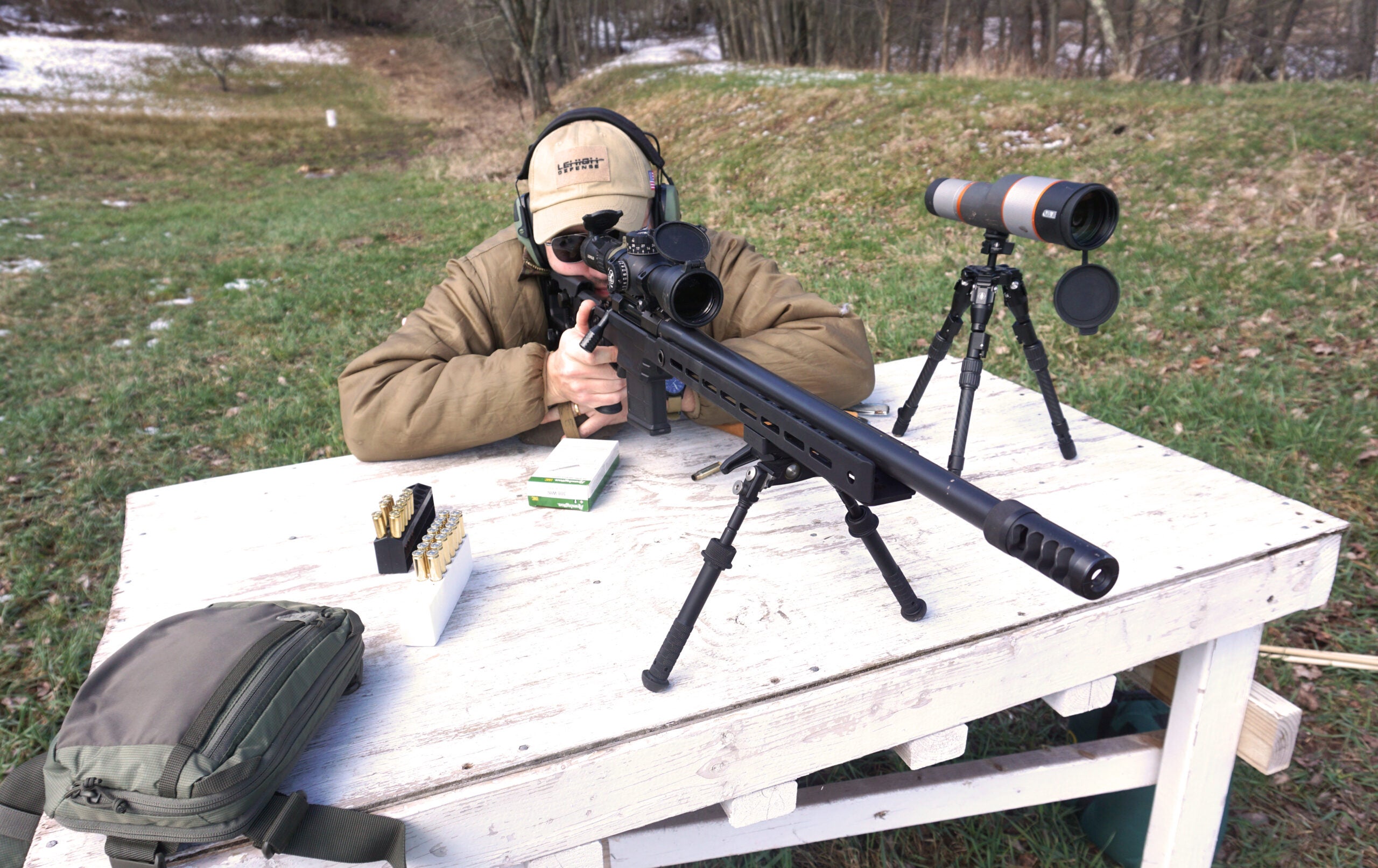 A shooter test fires the Aero Precision Solus Competition rifle from a bench rest. 