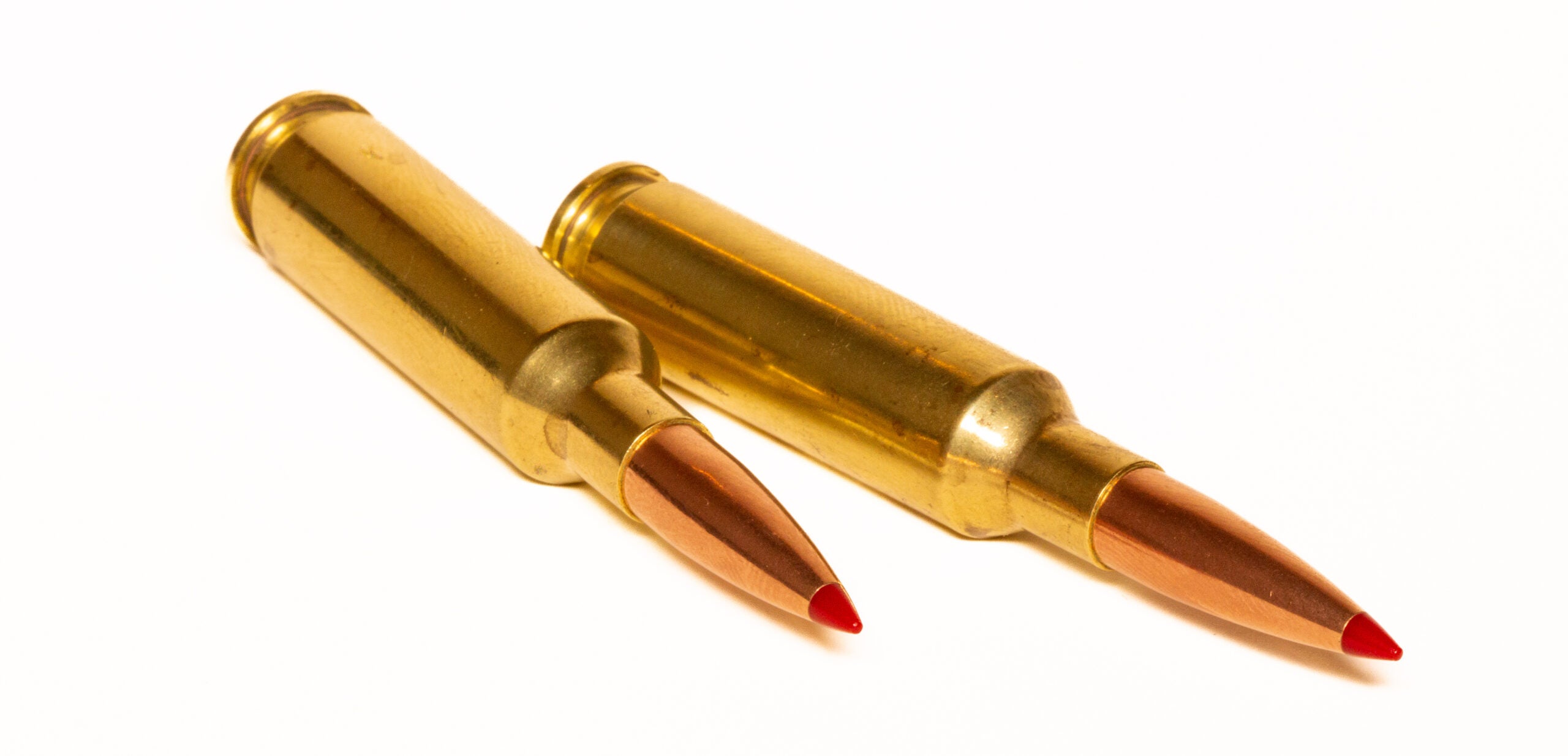 Two Hornady 6.5 Creedmoor cartridges on a white background.