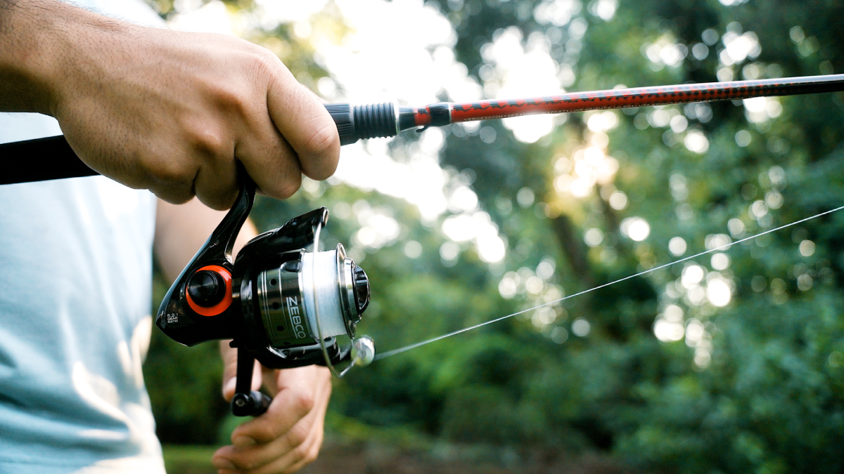 Angler holding Zebco rod and reel combo