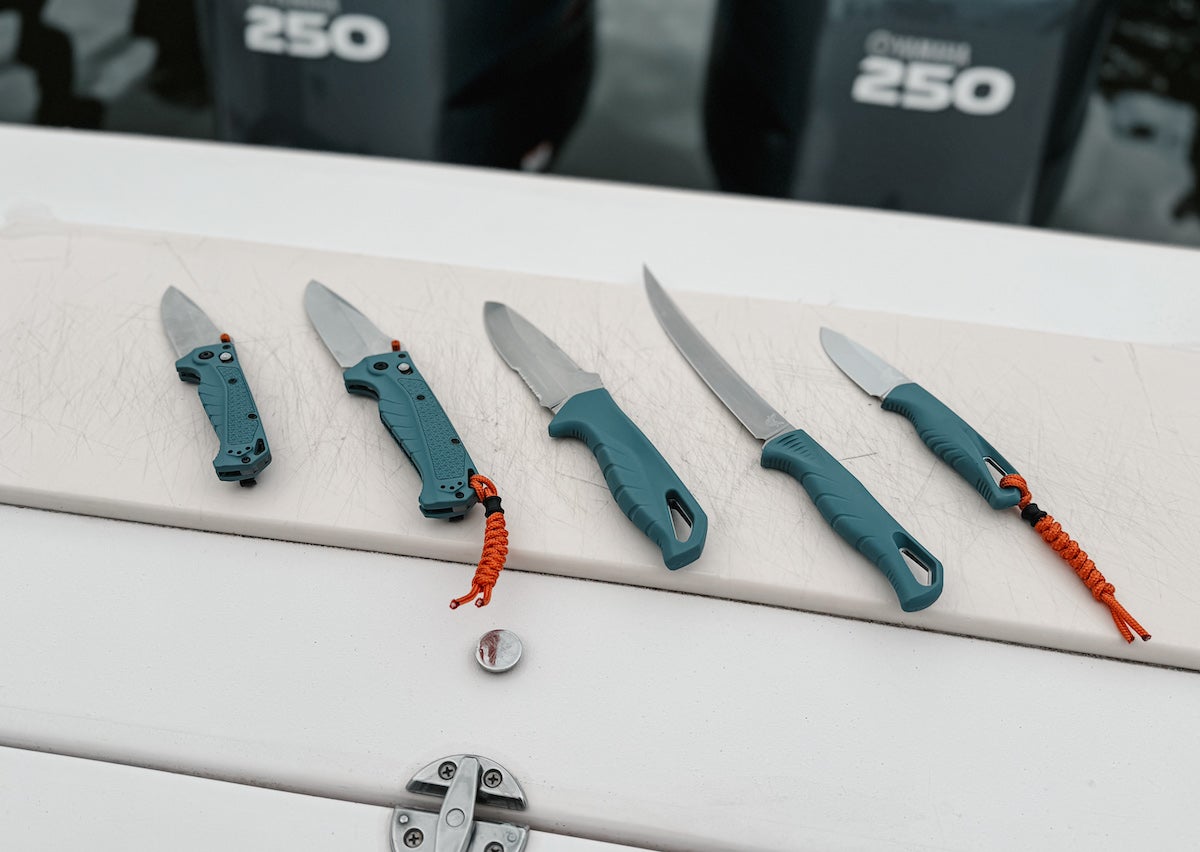 Benchmade Water Series knives laid out on bait station of boat