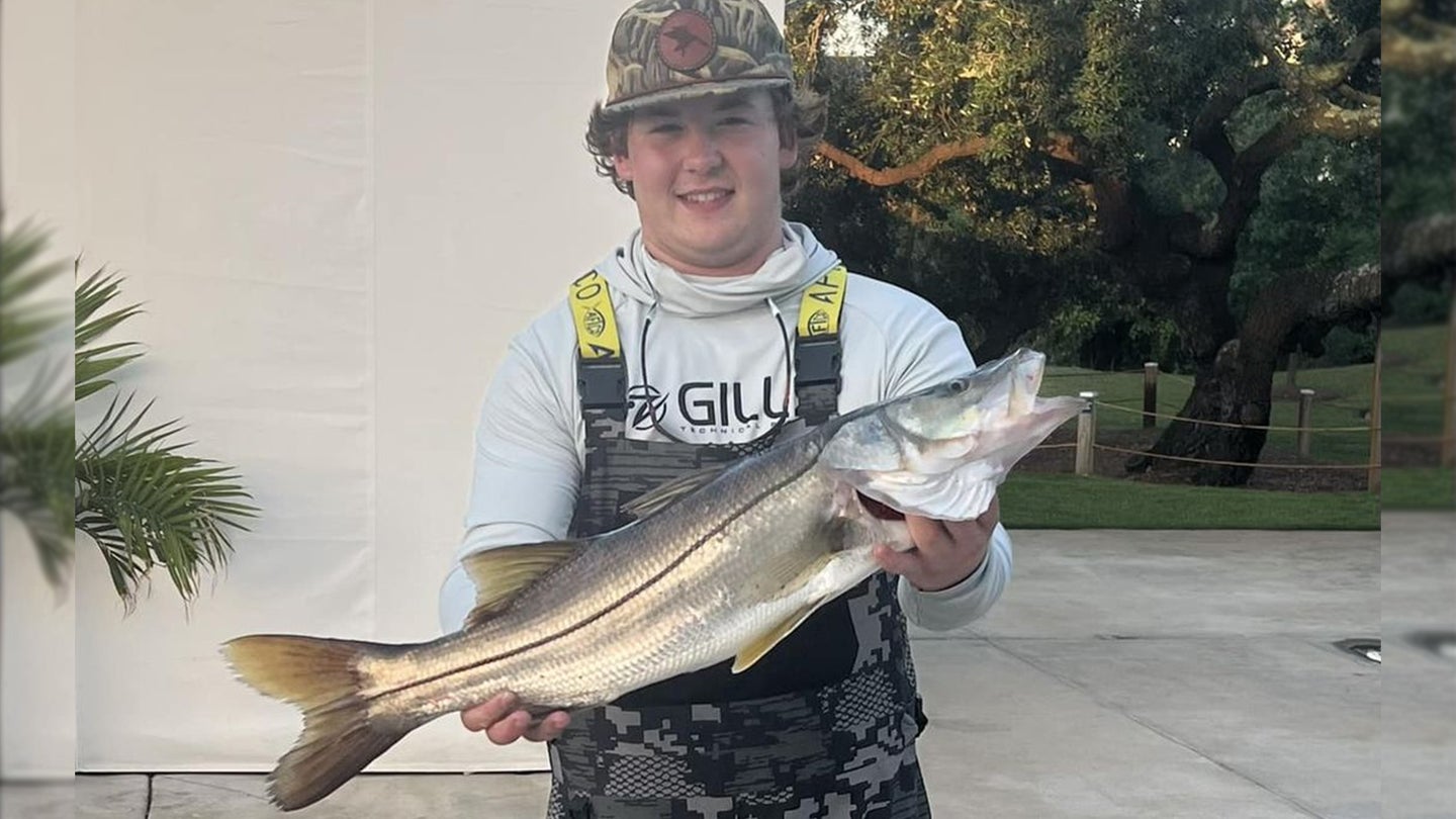 Young angler poses with a pending Alabama state record snook.